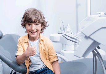 Early Orthodontic Treatment For Boy In Chair