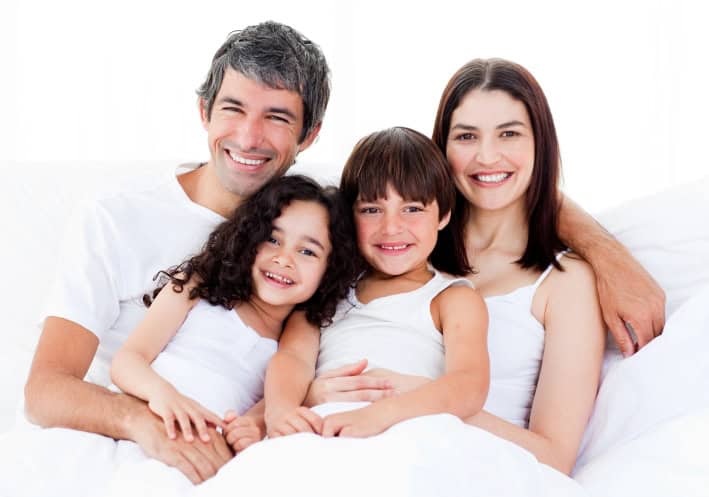 Family Showing Off Their Great Smiles